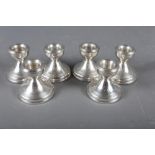 A set of six filled silver squat candlesticks, 2 1/4" high