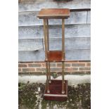 A 19th century French mahogany and brass three-tier etagere, on fluted columns and square base,