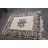 A Moroccan rug with geometric designs, central medallion and multi-borders on a cream ground in