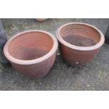 A pair of bulbous terracotta plant pots, 19" dia x 14" high