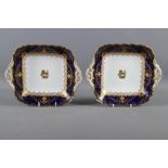 A pair of Coalport porcelain dishes with gilt armorial decoration, 9 1/2" wide