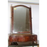 A George III mahogany and banded swing frame toilet mirror, on serpentine front plateau base, fitted