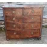 A Victorian figured mahogany bowfront chest of two short and two long drawers with brass ring