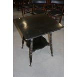 An Aesthetic design ebonised square top two-tier occasional table, on turned supports and ball and