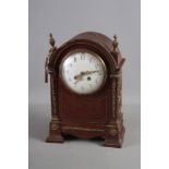 A French? mahogany cased mantel clock with brass decoration, white enamel dial and Arabic