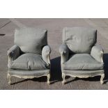A pair of Louis XVI design white painted showframe deep seat armchairs with down loose seat and back