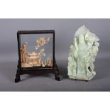 A Chinese carved cork panel of a pagoda in a landscape, in case, 9 1/2" high, and a carved jadeite