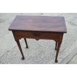 A late Georgian mahogany side table, fitted one drawer, on turned supports and pad feet, 28" wide