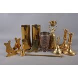 A brass wager cup, 8 1/2" high, a pair of brass candlesticks, a 19th century electrotype beaker with