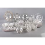 A quantity of glass ice plates, moulded glass mugs, glass bowls and other glassware