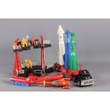 A collection of 1950s and 1960s plastic toys, including space rockets, early Thunderbirds, etc