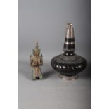 An Indian ceramic and white metal bottle neck vase with elephant finial, 10 1/4" high, and a bronzed