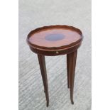A late Georgian mahogany oval inlaid tray top urn stand with drip slide, on square taper splay