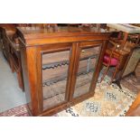 A late Victorian walnut bookcase enclosed glazed panel doors, on block base, 41" wide x 11" deep x