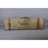 A green canvas and leather bound gun case, initialled "R.M.R.", 33" wide