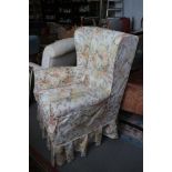 A wing-back armchair with floral loose cover, a showframe nursing chair and an oak footstool