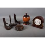 A lignum vitae jar and cover, 7" high, a Mercedes mahogany cased electric mantel clock, three