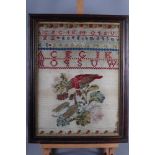 An alphabetical and numerical sampler with flower and bird designs, 17 1/2" x 13 1/2", in wooden