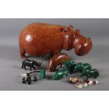 An ironwood model of a hippopotamus, 6 1/2" high, another smaller similar model pig, five