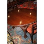 A late 19th century mahogany oval extending dining table with three extra leaves, on cabriole claw