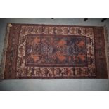 An Afghan rug with lion and Russian tank design on a plum ground, 79" x 44 1/2" approx
