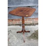 An early 19th century mahogany and rosewood banded square tilt top occasional table, on turned