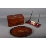 An early 20th century mahogany and banded tea caddy, 10 1/4" wide x 5 3/4" high, an oval gallery