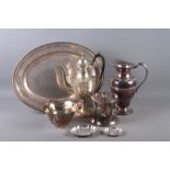 An Edwardian silver plated and engraved coffee pot, a plated jug, an ice bucket, two embossed