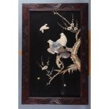A pair of Shibuyama panels, decorated birds and trees, in carved wooden frames, 23 1/4" high x 13