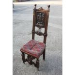 A 19th century Renaissance revival carved walnut side chair with panel back monogrammed "A.D.",