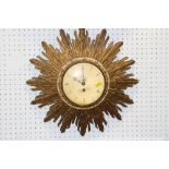 A Cray Pond giltwood sunburst clock with eight-day movement, gilt dial and Roman numerals, 17" dia