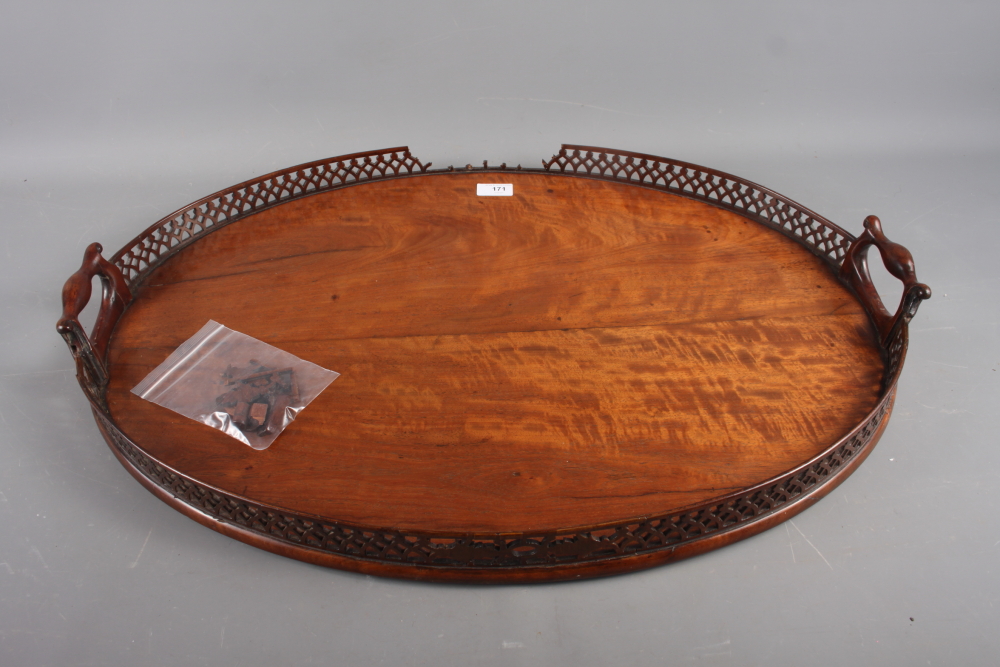 A late 19th century figured mahogany two-handled tray with pierced gallery, 29" wide (losses and