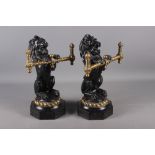 A pair of mid 19th century cast iron and brass lion implement rests/fire dogs, 14" high x 11" wide