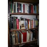 A large collection of books and novels, mostly non-fiction