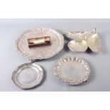 A silver plate on copper tray, 13 1/2" dia, two smaller similar trays, a mussel tray and a rolled