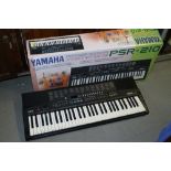A Yamaha Portatone PSR 210 electronic keyboard with 100 sounds, 50 rhythms and 15 songs with