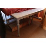 An OKA dove grey painted extending dining table with four extra leaves, on turned supports, top 138"