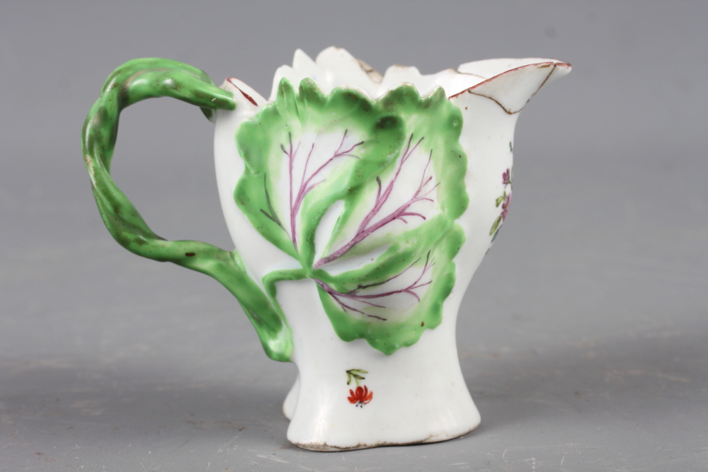 A Longton Hall cream jug with openwork twist handle and leaf relief decoration and enamel floral - Image 3 of 11