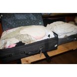 Two suitcases containing a quantity of linen and lace