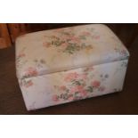 A box seat ottoman, interior fitted as a filing cabinet, upholstered in a glazed chintz, 32" long