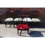 A set of four 19th century mahogany vertical rail back dining chairs with stuffed over seats and