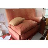 A Knowle two-seat settee with down loose cushions, upholstered in a pink brocade, 72" wide