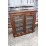 A mahogany display bookcase enclosed glazed panel doors, on block base, 43" wide, and a 1950s nest