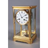 A French brass four-glass mantel clock with striking movement and mercury pendulum by A D Hougin, 10