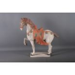 A Tang style painted terracotta model of a horse, 20 1/4" high