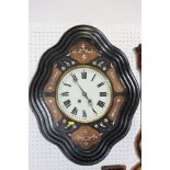 A French ebonised and mother-of-pearl inlaid boudoir clock with white enamel dial and Roman