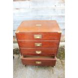 A mahogany and brass bound "military" cabinet enclosed cupboard, decorated three faux long