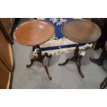 Two walnut wine tables of Georgian design, on tripod splay supports, 12" dia x 20 1/2" high