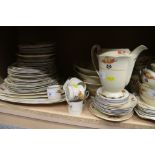 A Woods Ivory Ware part combination service with floral decoration