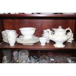 A mid 19th century bone china and gilt decorated matched part tea service, including teapot, cream